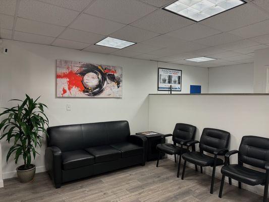 The waiting area at NE-PLUS ULTRA CHIROPRACTIC, clean, modern, and welcoming atmosphere. Thoughtfully designed with comfortable seating.