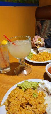 Margarita drinks, rice, beans, guacamole, and sour cream.  Chips and salsa at Mama Maria's.