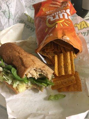 Chicken teriyaki with spinach, lettuce , green peppers & onions with a side of sun chips.