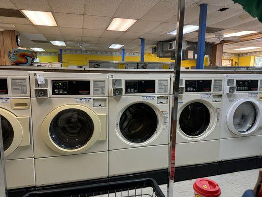 First machine marked out of order, next two didn't have doors. Last machine on right was overfilled with soap pouring out of it.