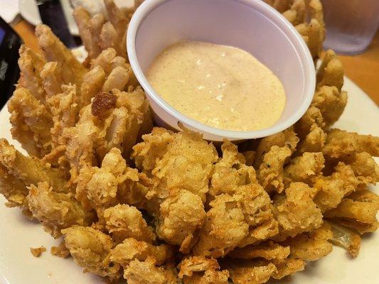 Cactus bloom (blooming onion). It's delicious but yo breath be kickin!