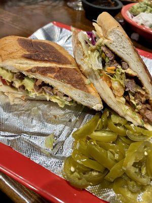 Torta de Carne Asada - Fresh juicy cut steak, garnished with lettuce, cheese & homemade pico de gallo sauce on house made bread