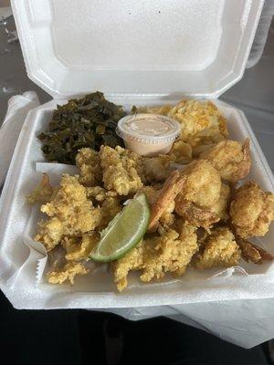 Conch and Shrimp Dinner with greens, Mac n cheese and rice. (Delicious rice with beans underneath the conch and shrimp.