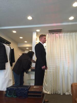 Getting fitted to look fly for his wedding tomorrow!!