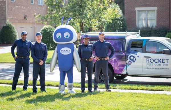 Rocket Pest's team and mascot ready for action at a client's home. Your trusted pest control experts!