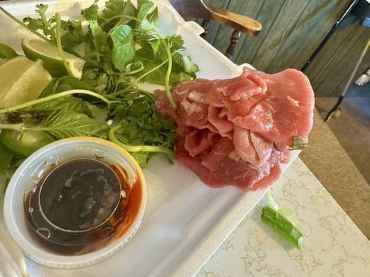 With tax. $22. Large beef pho two spring rolls two fried rolls. Sauce is perfect. Tons of meat. Tons of sprouts and herbs. Amazing.