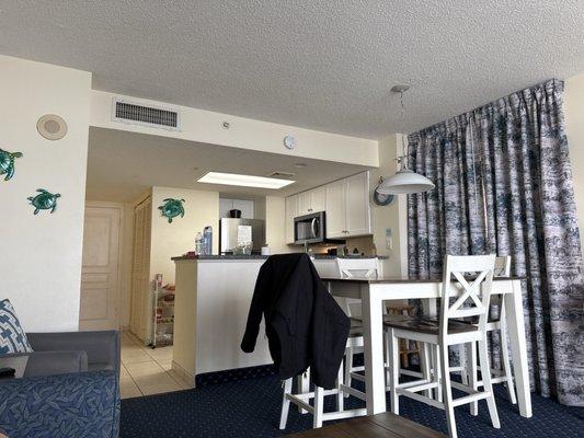 Kitchen and dining area in room