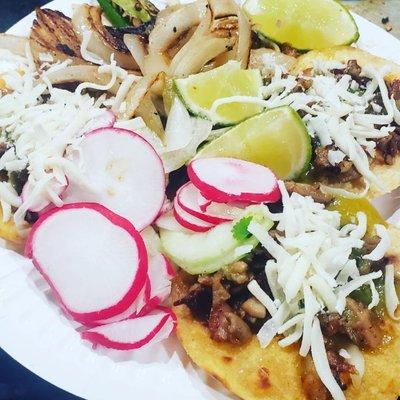 3 tacos de asada con pastor. cheese. Onion.