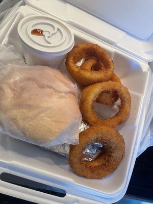 Pulled pork plate with onion rings and beans.  They butter and toast the bread for you!