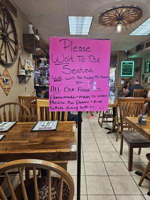 Take note of the sign.  Good food - very slow service- but due slow kitchen.