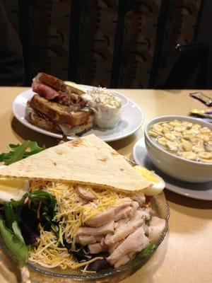 A Ruben sandwich and Chef Salad. A bowel of chicken soup.