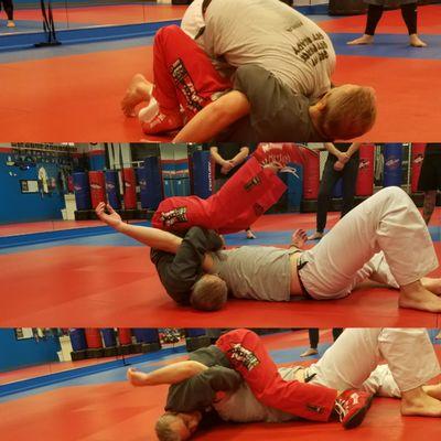 Sensei Nae demonstrating a technique during  grappling class.