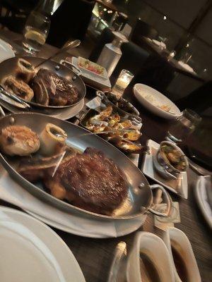 Bone in rib-eye, potato skins, creamed spinach, mushrooms