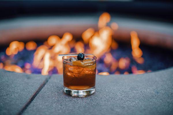 Relax on the outdoor patio and enjoy your drink by the fire.