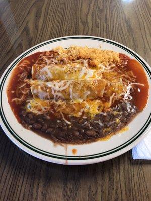 Shredded beef enchiladas with rice and beans