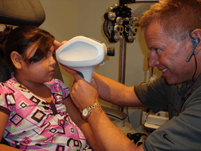 Dr. Frank helping one of our many younger patients.