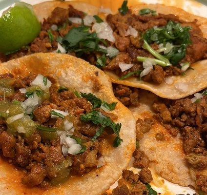 Tacos de pastor with green salsa