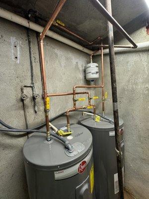 Install two electric water heaters