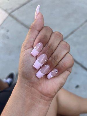 Light pink French tip nails with jewels