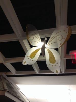 They have springtime decorations hanging from the ceiling.