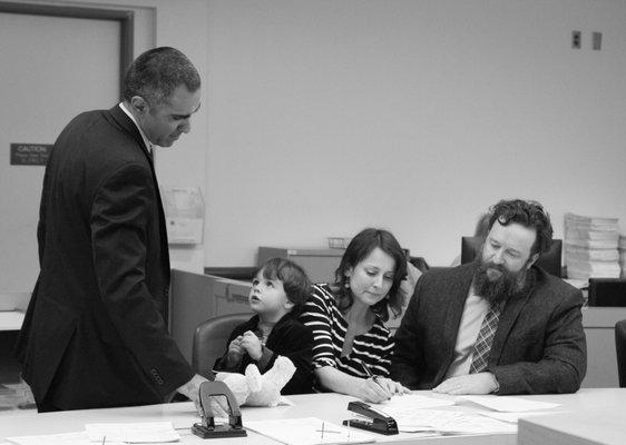 Signing the adoption paper work while Atty. Khorram looks on. (i'm not crying, you're crying!!)