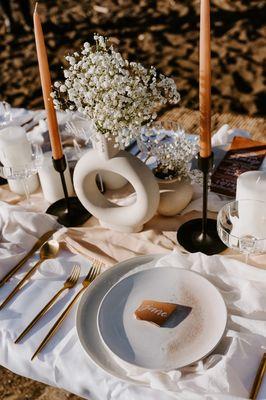 Table details for a sunset beach engagement