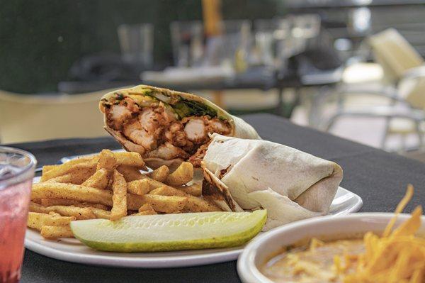 Buffalo Chicken wrap   Crispy Chicken Tenders Tossed in a Buffalo Sauce, Swiss Cheese, Mixed Greens, Pickles, Wrapped in a Flour Tortilla