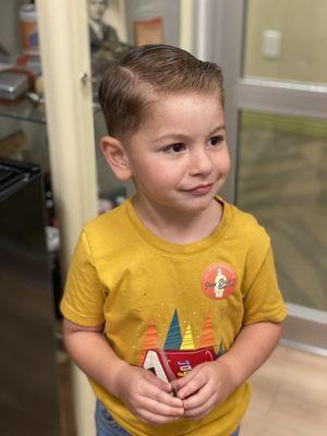 Such a handsome little guy. He loves getting his hair cut and receiving his "I sat like little a gent" sticker.