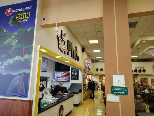 Inside the Galleria Market at the food court next to "K Foods"