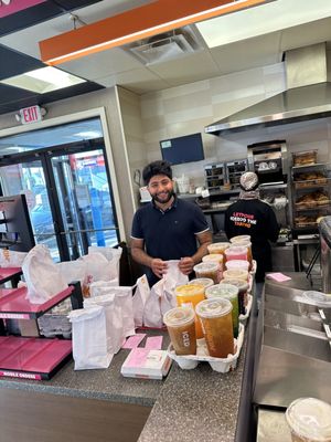 Dunkin manager and Crew working with a happy smile