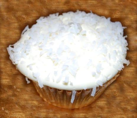 A Little Piece of Heaven- coconut cake, strawberry center, topped with cream cheese frosting and coconut shavings