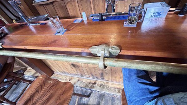 Brass rail on the bar