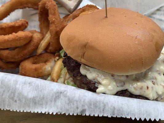 the BLEU CHEESE BACON BURGER (burger patty, bleu cheese crumbles, bacon bits, shredded lettuce, and tomatoes) with onion rings