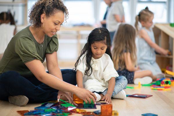 Montessori teacher and student doing an activity