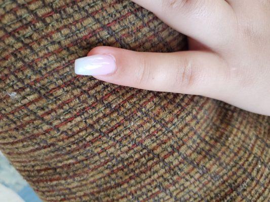 Crooked pinky nail.