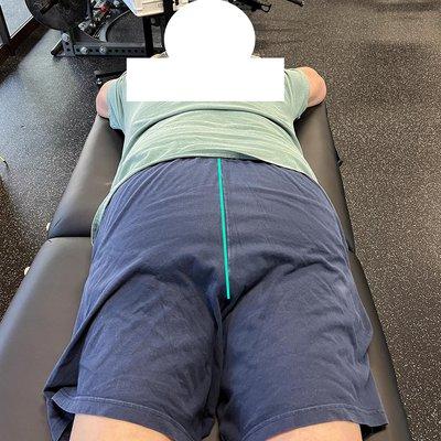 in-person client: lower back and hip assessment.