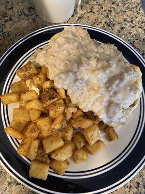 Sausage and gravy over biscuits with breakfast potatoes