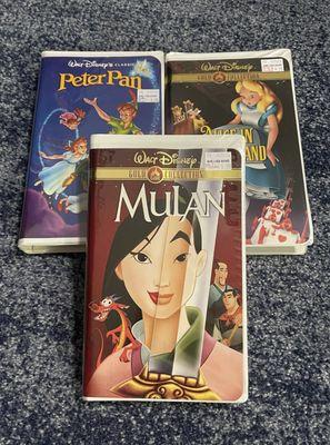 Peter Pan, Alice in Wonderland, and Mulan VHS tapes