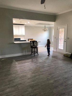 After- Gray Owl on the walls, White Upper Cabinets, White Backsplash.