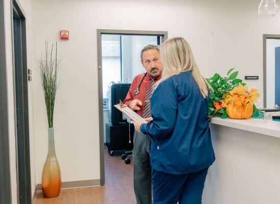 Dr. Carr talking to nurse