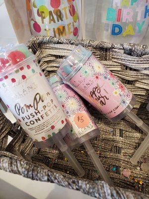 Push pops!  Poms Poms or confetti filled.