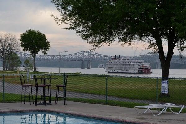 Paddle Boat going by RV Park with pool in back ground