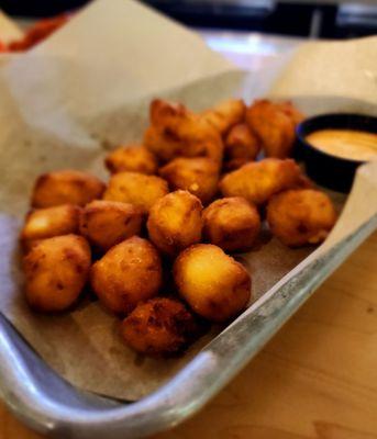 Cheese curds. Eat them with caramel and they taste like a funnel cake.