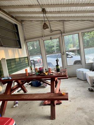 Enclosed porch, great to hang out without getting eaten alive by bugs.