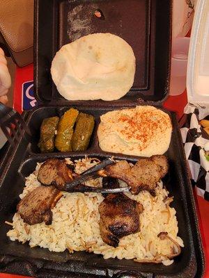 100% delicious! Lamb rack, hummus,  grape leaves, bread, and rice. Omg, and the garlic sauce is the great (not in the picture)!