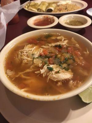 Delicious chicken soup and enchiladas verde