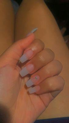 Natural medium length nails with a gem