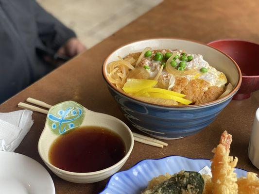 Tonkatsu donburi and a glimpse of tempura and the dipping sauce.