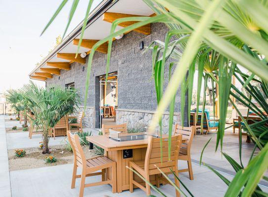 Newly constructed outdoor patios on the other side of the garage doors from the Toptracer Bays.