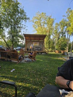 Backyard with live music and a variety of seating options.